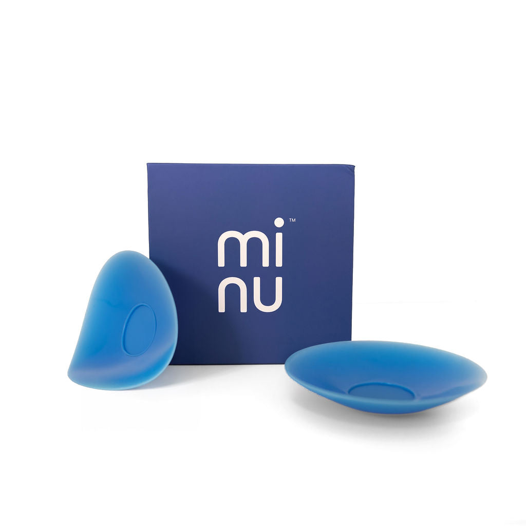 A Bondi blue silicone minukini accessory set with a matching blue box featuring the white 'mi nu' logo, photographed on a clean white background.